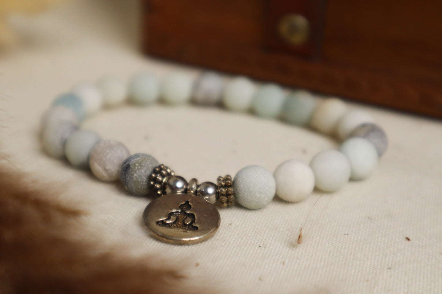 Bracelet avec de l'amazonite et un pendentif Bouddha.